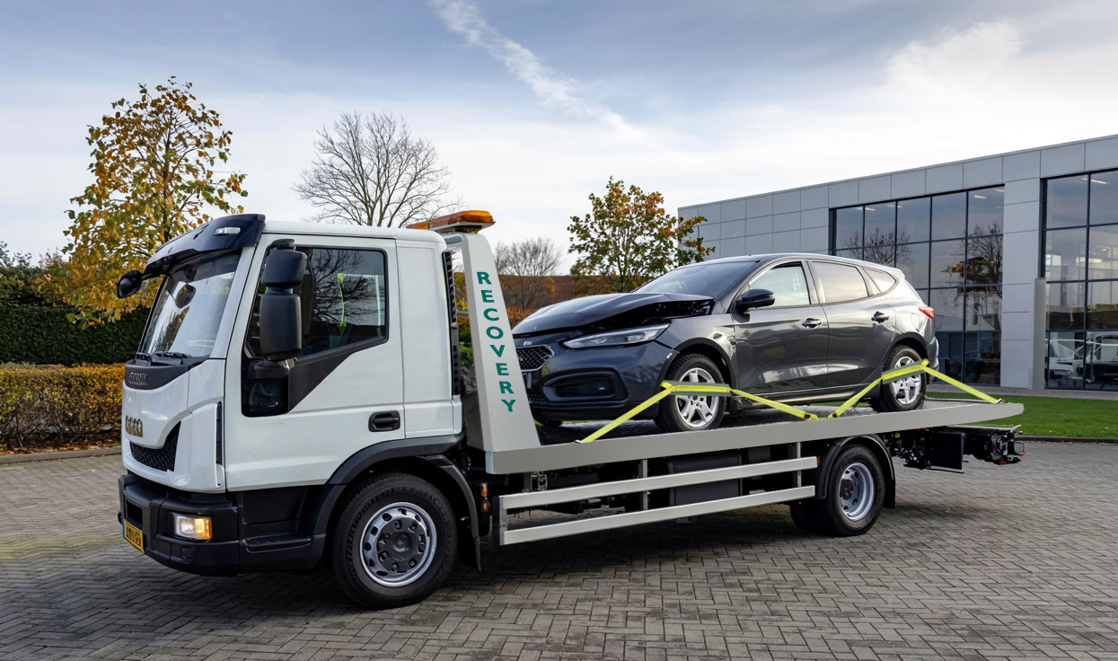 Services - GMP Motors SW - an IVECO Eurocargo long flat-bed recovery truck transporting a damaged black car